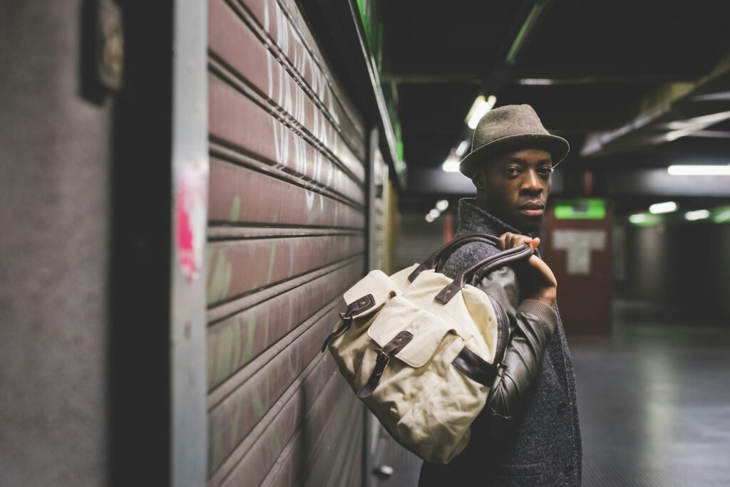 young handsome afro black man in a underground station